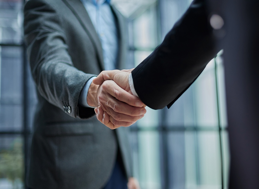 Colaizzo Thompson Insurance Associates - Closeup of Two Business People Shaking Hands
